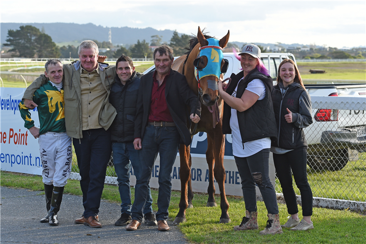 Ken Rae (red shirt, holding horse) with Gigolo George after his home track victory at Ruakaka