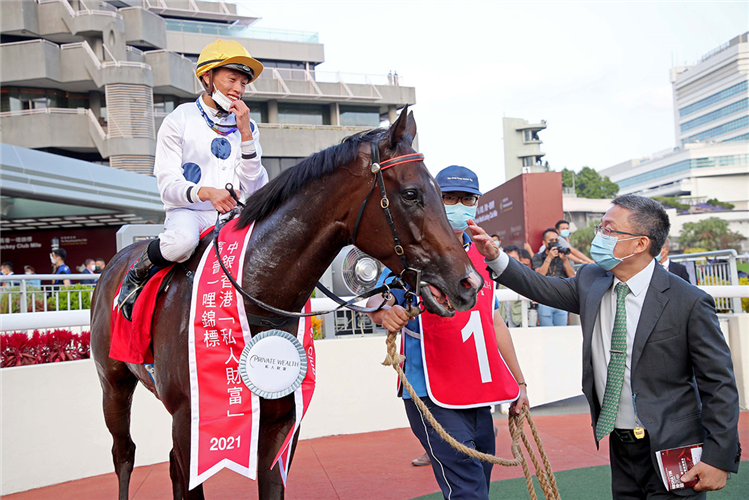 Francis Lui pats Golden Sixty following his win.