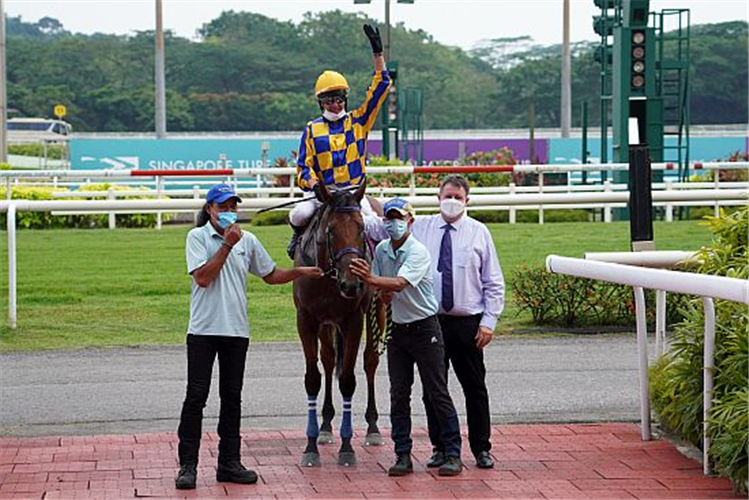 Jockey Marc Lerner and trainer Stephen Gray pose for the camera after Hard Too Think's triumph.