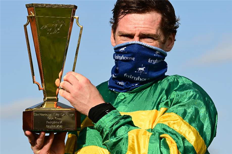 JANIDIL won for jockey JODY McGARVEY pictured with the Gold Cup.
