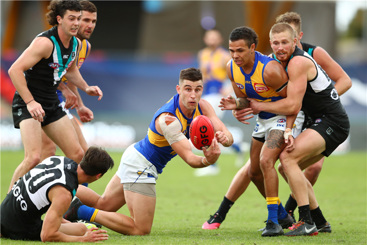 ELLIOT YEO of the Eagles handballs during the AFL match between the Port Adelaide Power and the West Coast Eagles at Gold Coast, Australia.