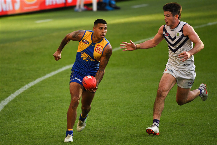TIM KELLY of the Eagles looks for the handless options during the AFL match between the West Coast Eagles and the Fremantle Dockers at Optus Stadium in Perth, Australia.