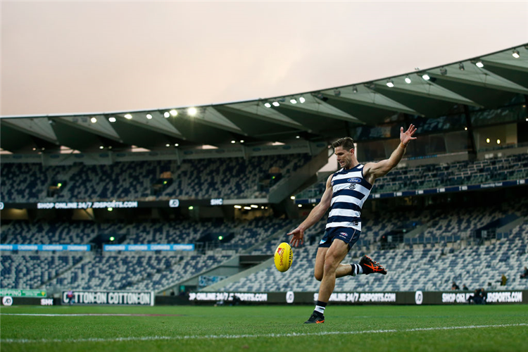 TOM HAWKINS of the Cats kicks at goal during the AFL match between the Geelong Cats and the Gold Coast Suns at GMHBA Stadium in Geelong, Australia.