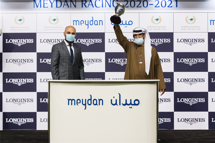 Ali Rashid Al Rayhi accepts a winning trophy from Longines