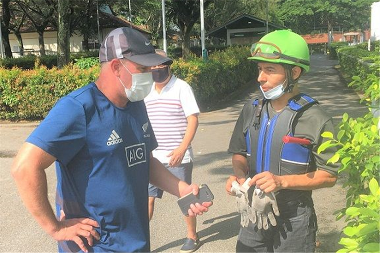 Oscar Chavez chatting with trainer Mark Walker at the barrier trials on Tuesday.