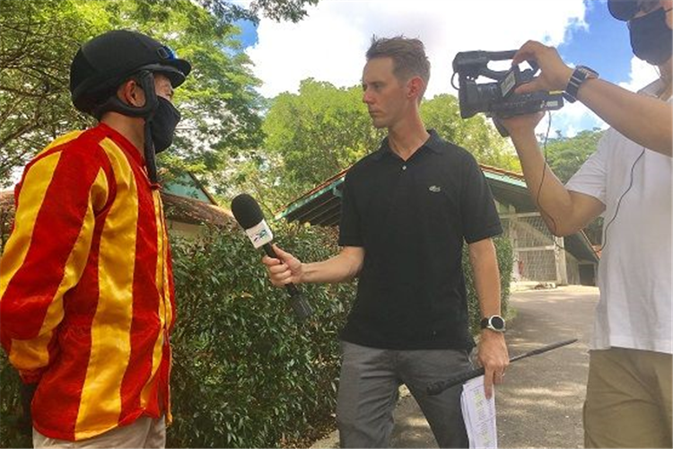 Scott Bailey at his first day at the office interviewing jockey Wong Chin Chuen.