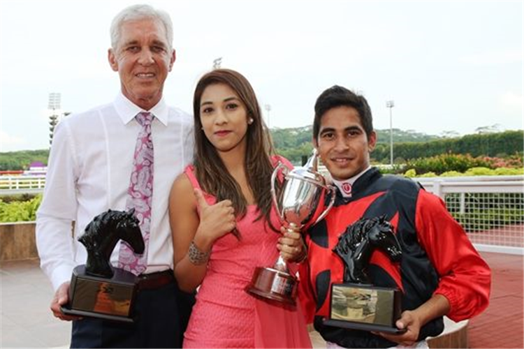 Nooresh Juglall celebrates with wife Chaaya and trainer Patrick Shaw after winning the Group 3 Garden City Trophy on Rafaello on August 21, 2016.