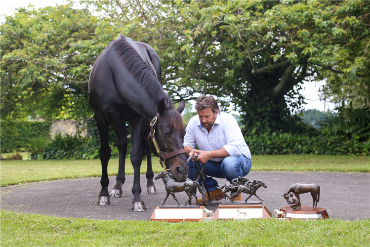 Waikato Stud’s Mark Chittick looks on as newly crowned Savabeel inspects his trophies from the 2020-21 season.