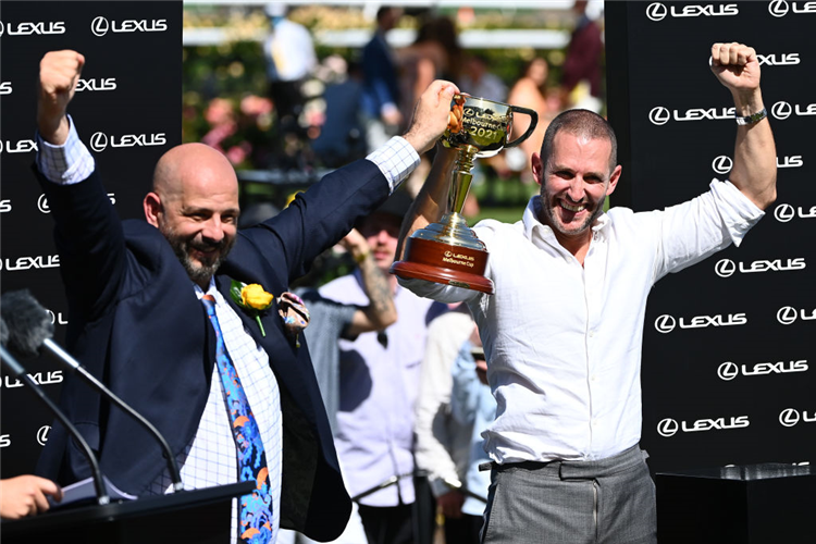 Verry Elleegant owners Brae Sokolski and Ozzie Kheir (left) celebrate with the Lexus Melbourne Cup.