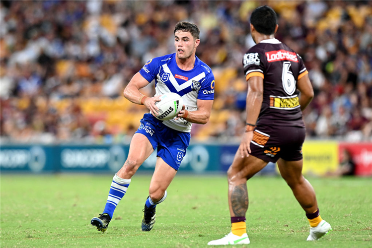 KYLE FLANAGAN of the Bulldogs looks to pass during the NRL match between the Brisbane Broncos and the Canterbury Bulldogs at Suncorp Stadium in Brisbane, Australia.