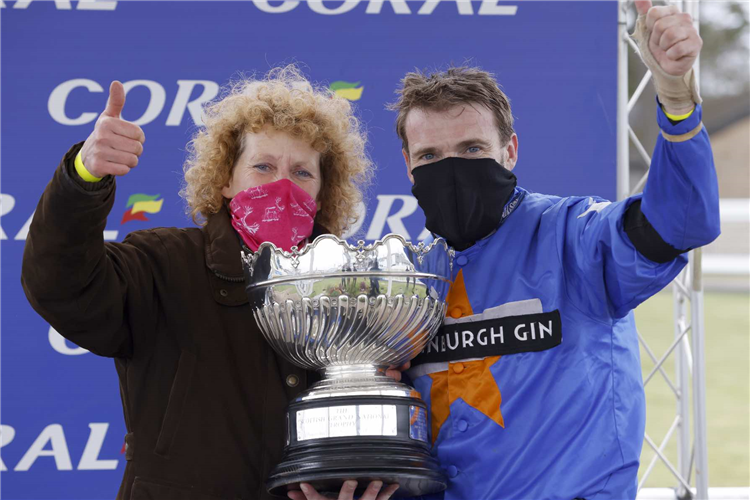 Lucinda Russell and Tom Scudamore after winning The Coral Scottish Grand National Handicap Chase with Mighty Thunder.