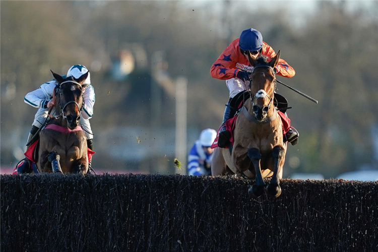 BRAVEMANSGAME (RHS) winning the King George VI Chase at Kempton Park in Sunbury, England.