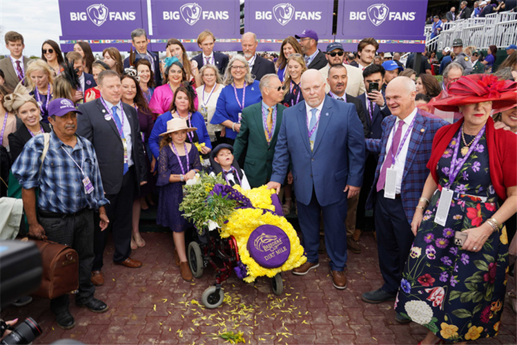 Cody's Wish named after young boy Cody Dorman (pictured in winners enclosure) won for trainer Bill Mott.