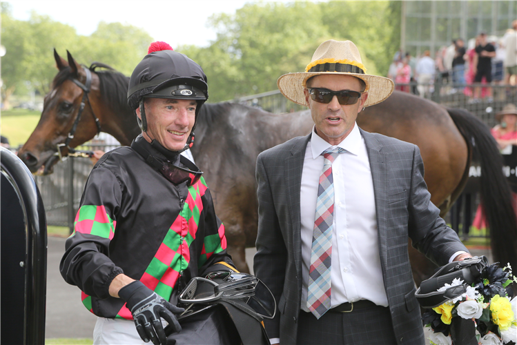 Graham Richardson with jockey Warren Kennedy after the win by Defibrillate