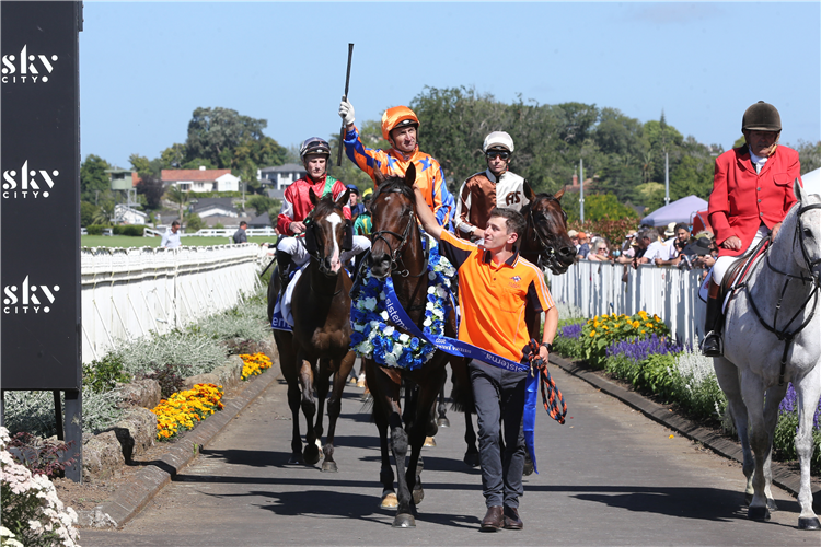 Opie Bosson salutes as he brings Entriviere back to the Ellerslie birdcage.