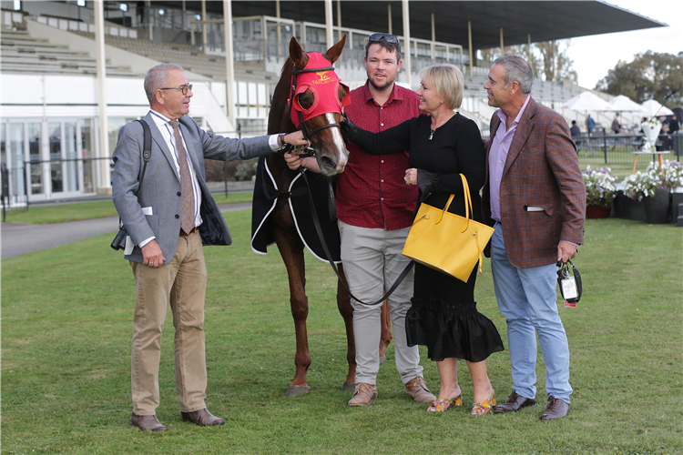 Co-trainer Roger James (left) with Cherry and Brent Taylor after the win by Two Illicit
