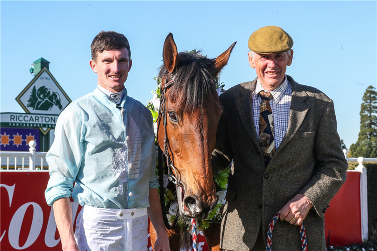 Trainer Mark Oulaghan and jockey Shaun Fannin pose with West Coast after his comfortable victory at Riccarton