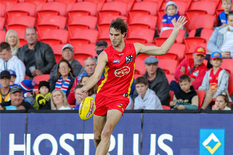 BEN KING of the Suns kicks the ball during the AFL match between the Gold Coast Suns and the Western Bulldogs at Metricon Stadium in the Gold Coast, Australia.