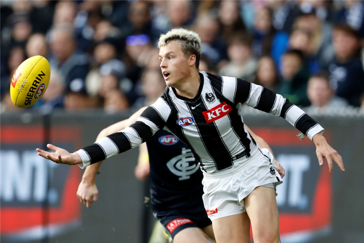 JACK GINNIVAN of the Magpies in action during the AFL match between the Carlton Blues and the Collingwood Magpies at the MCG in Melbourne, Australia.
