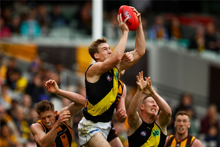 TOM LYNCH of the Tigers marks the ball during the AFL match between the Hawthorn Hawks and the Richmond Tigers at MCG in Melbourne, Australia.