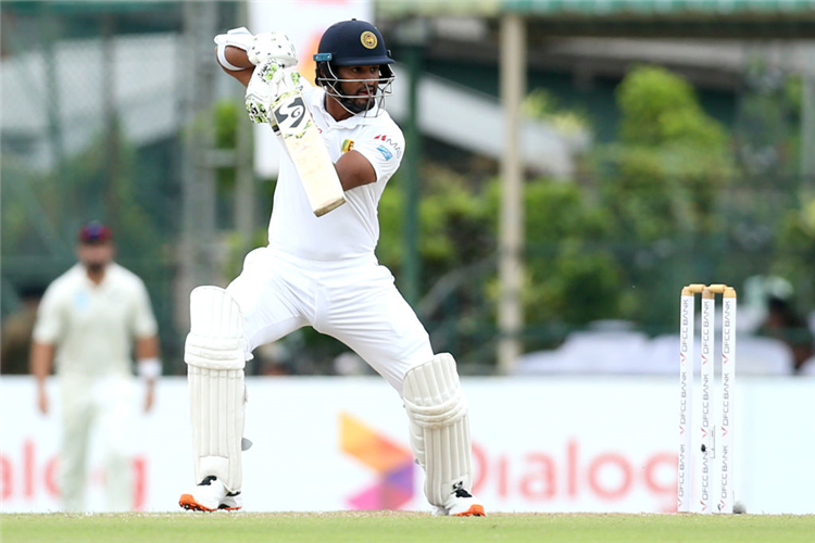 Sri Lanka captain DIMUTH KARUNARATNE hits out during the Test match between Sri Lanka and New Zealand at Paikiasothy Saravanamuttu Stadium in Colombo, Sri Lanka.