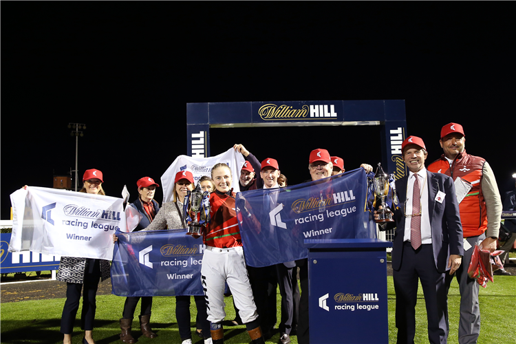 Jockeys and trainers of the winning team Wales and The West lift the trophy following the Racing League 2022 Race Week 6 Final meeting at Newcastle Racecourse.