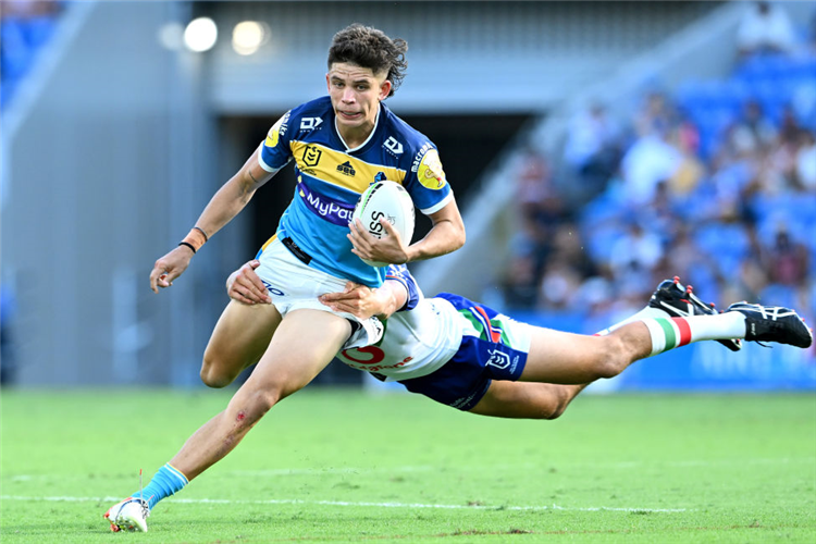 JAYDEN CAMPBELL of the Titans is tackled during the NRL match between the Gold Coast Titans and the New Zealand Warriors at Cbus Super Stadium in Gold Coast, Australia.