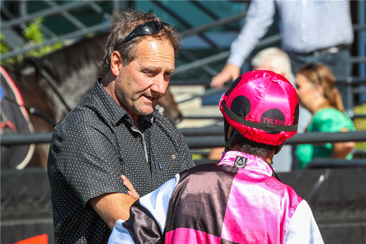Trainer Kelvin Tyler speaks to rider Kozzi Asano after the win by Tobilicious