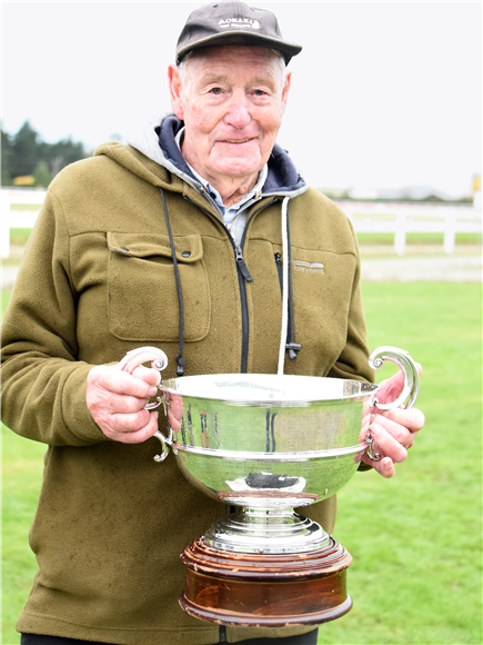 Trainer Leonard Stewart poses with the Waimate Cup after stable runner Vague took out the feature race at Timaru