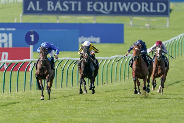 ANCIENT WISDOM (left, light blue cap) winning the Autumn Stakes at Newmarket in England.