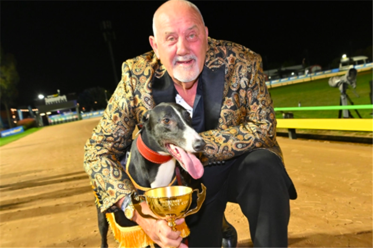 Aussie Rocks and Geoff Mitchell with the prized Sportsbet Melbourne Cup trophy.