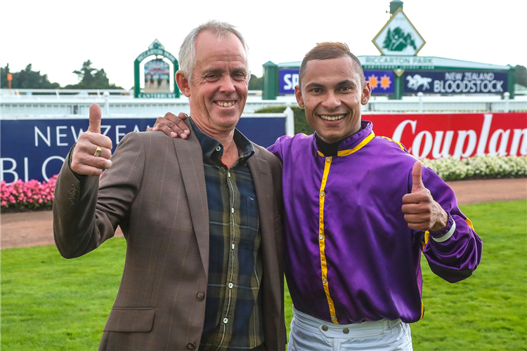 Trainer Lance Robinson and jockey Kavish Chowdhoory bask in the afterglow of a Group Three victory