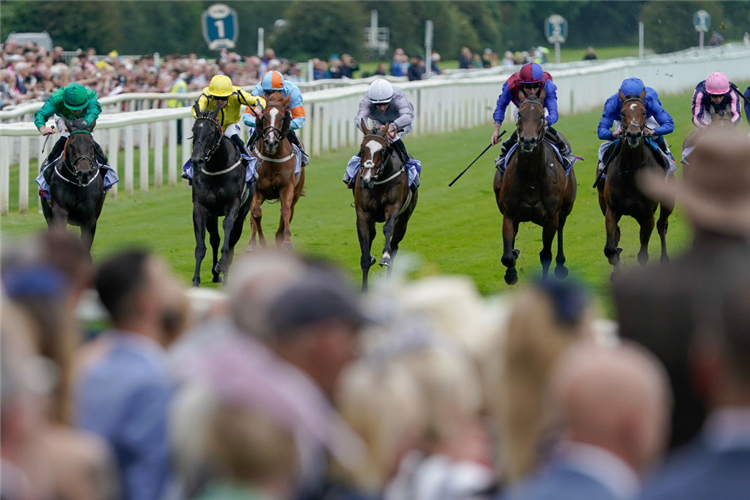 RELIEF RALLY (green cap) winning the Lowther Stakes at York in England.