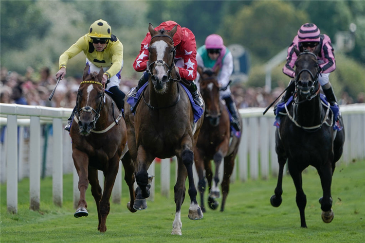 SPIRIT DANCER (C, red cap) winning the Strensall Stakes at York in England.