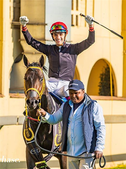 Jockey Calvin Habib pumps his fists up in the air after winning the Grade 1 Gold Horse Medallion aboard Thunderstruck in June last year.
