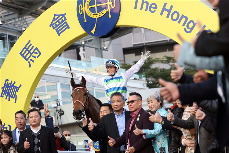 Jamie Kah celebrates the win aboard Voyage Bubble.