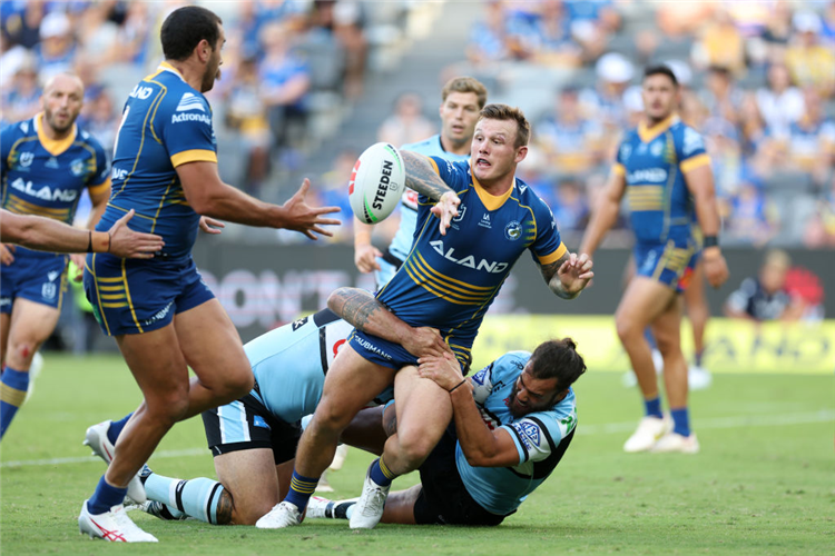 J'MAINE HOPGOOD of the Eels offloads during the NRL match between the Parramatta Eels and the Cronulla Sharks at CommBank Stadium in Sydney, Australia.