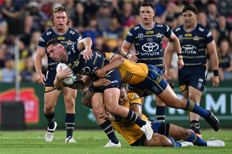 REECE ROBSON of the Cowboys is tackeld during the NRL Preliminary Final match between the North Queensland Cowboys and the Parramatta Eels at Queensland Country Bank Stadium in Townsville, Australia.