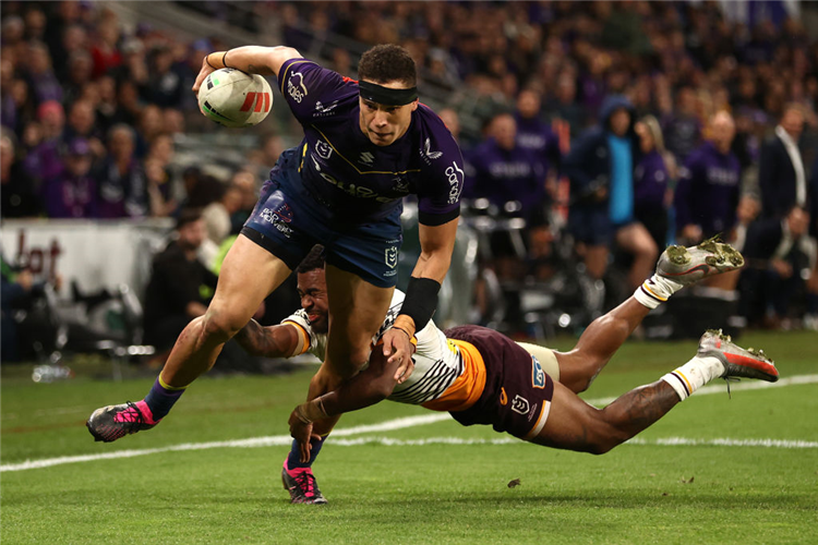 WILLl WARBRICK of the Storm breaks a tackle to score a try during the NRL match between Melbourne Storm and Brisbane Broncos at AAMI Park in Melbourne, Australia.