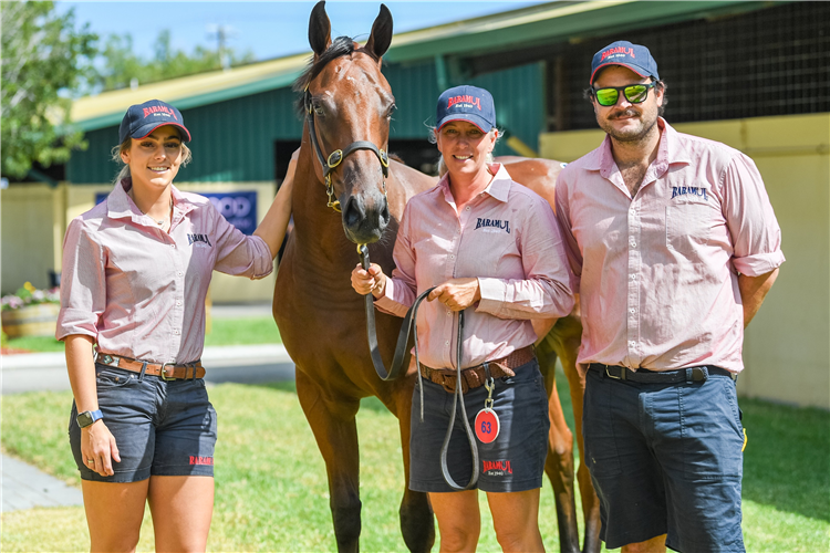 Baramul staff with the sale-topping I Am Invincible filly.