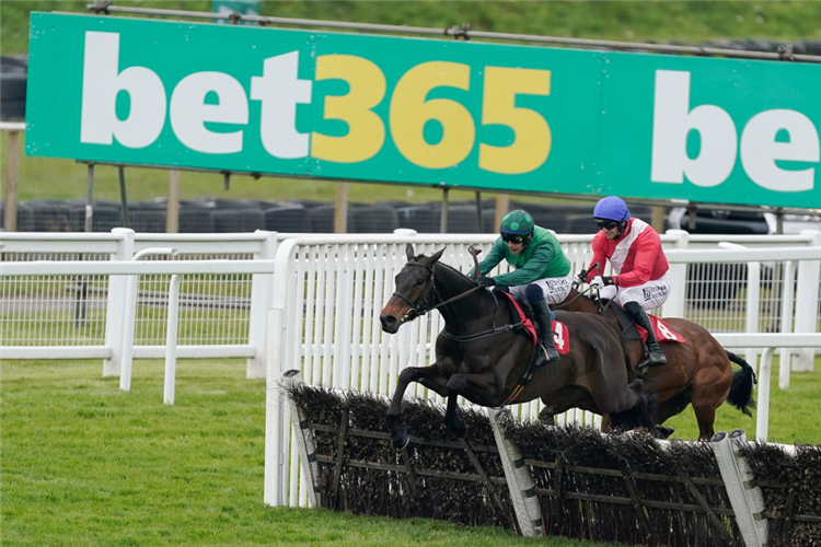 IMPAIRE ET PASSE winning the Select Hurdle at Sandown Park in Esher, England.