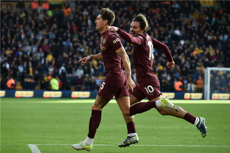 John Stones and Jack Grealish celebrate Man City's win against Wolves