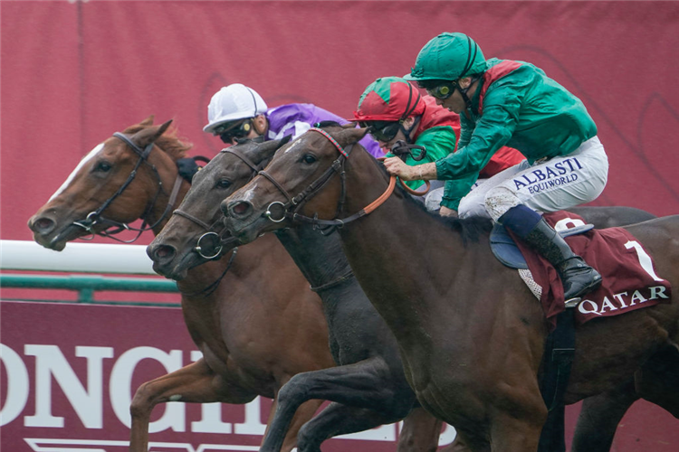 VERTICAL BLUE (centre, red/green cap) winning the Prix Marcel Boussac at Hippodrome de ParisLongchamp in Paris, France.