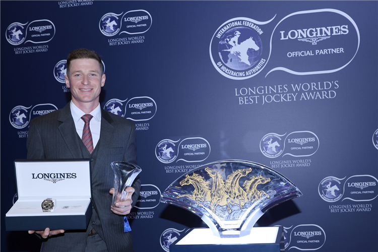 James McDonald is presented with a LONGINES watch and crystal vase.