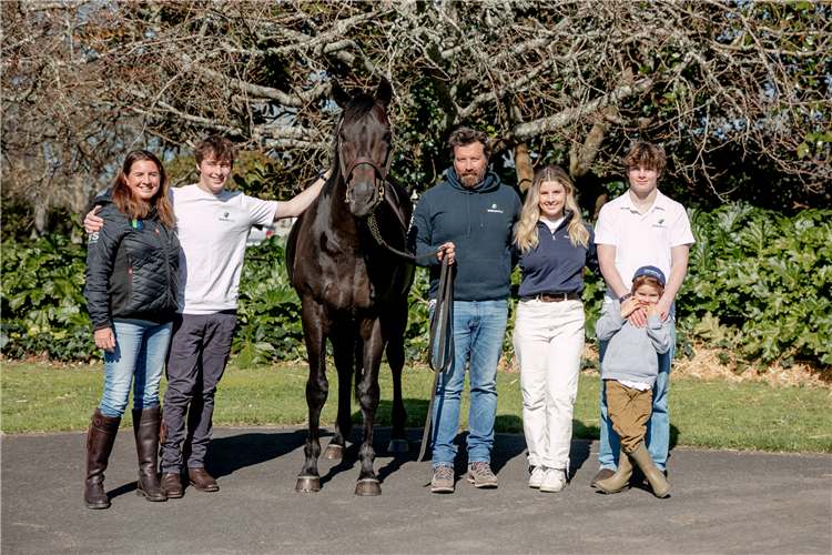 Waikato Stud principal Mark Chittick and his family pictured with the farm's champion stallion Savabeel.