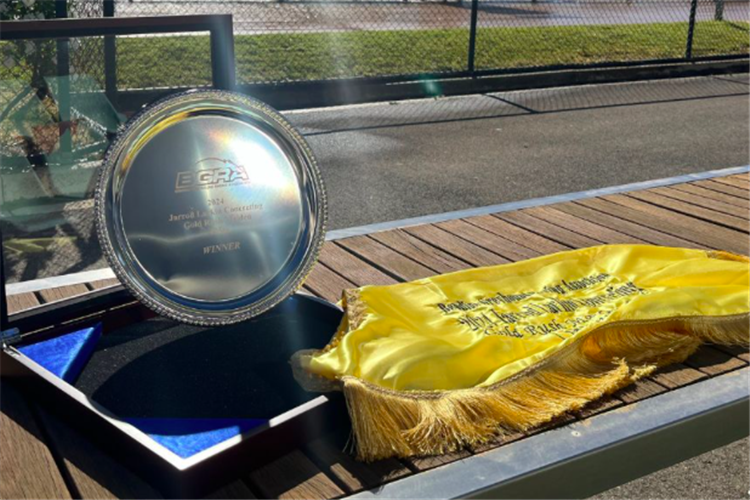 Gold Rush Maiden trophy and sash.
