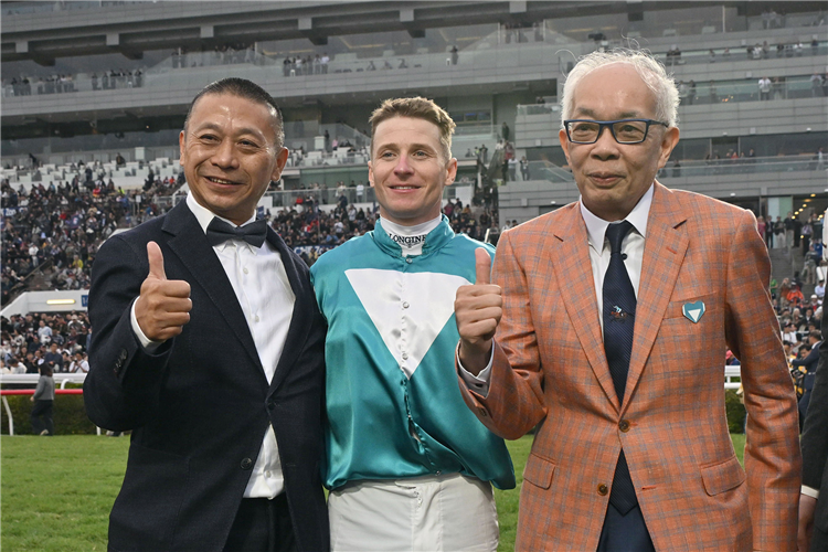 Danny Shum celebrates with Romantic Warrior’s owner, Mr Peter Lau.