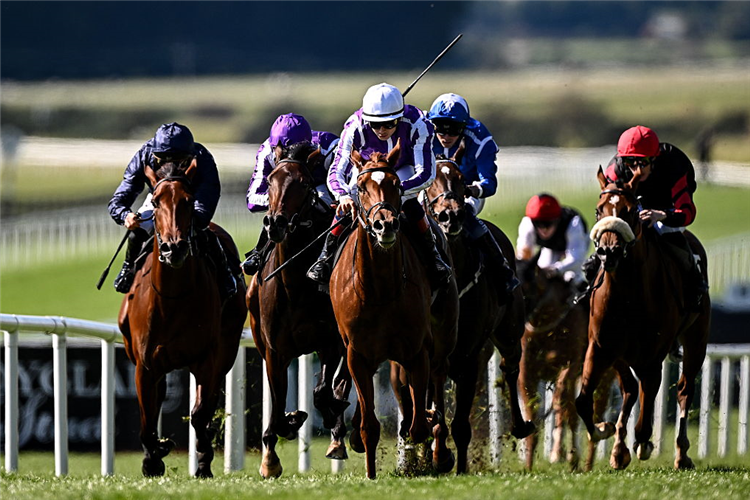 PRECISE (white cap) winning the Moyglare Stud Stakes at Curragh in Kildare.