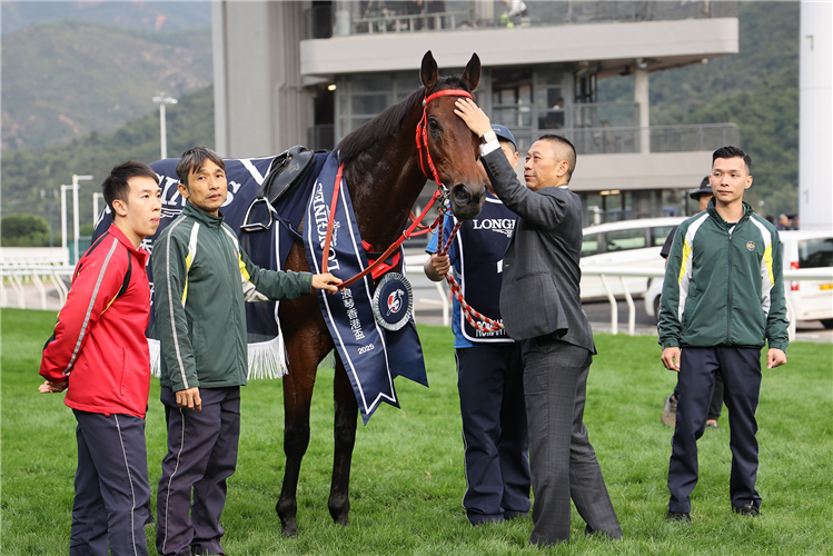 Danny Shum celebrates with Romantic Warrior post-race