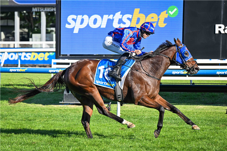 HUGHES winning the Sportsbet Victoria Handicap at Caulfield in Australia.